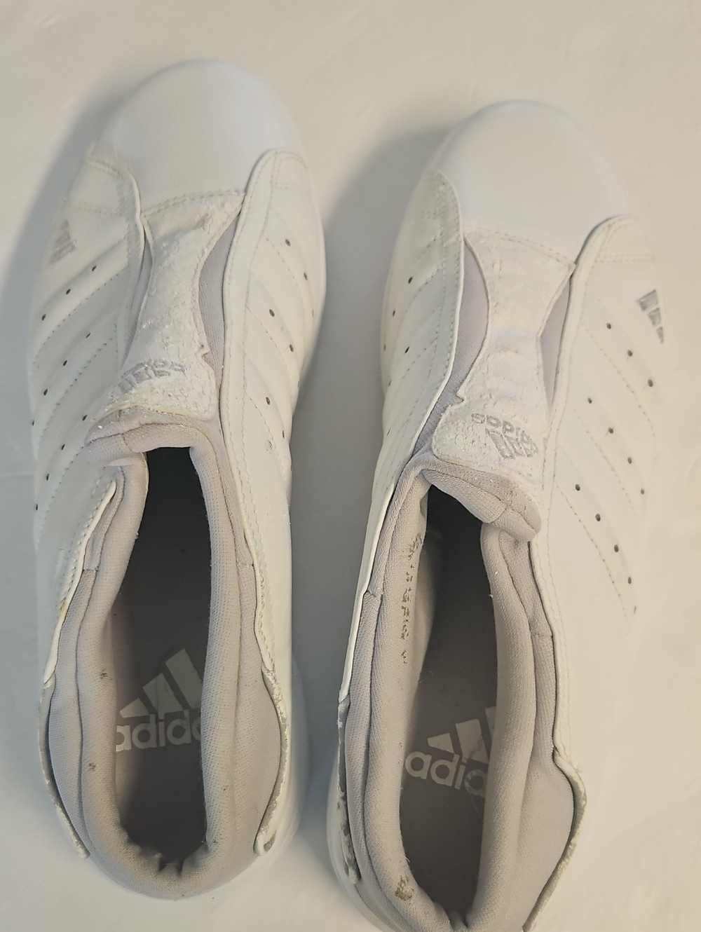 adidas Women’s White Slip-On Athletic Sneakers with Subtle Perforation